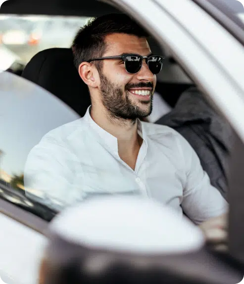 Man with sunglasses in car